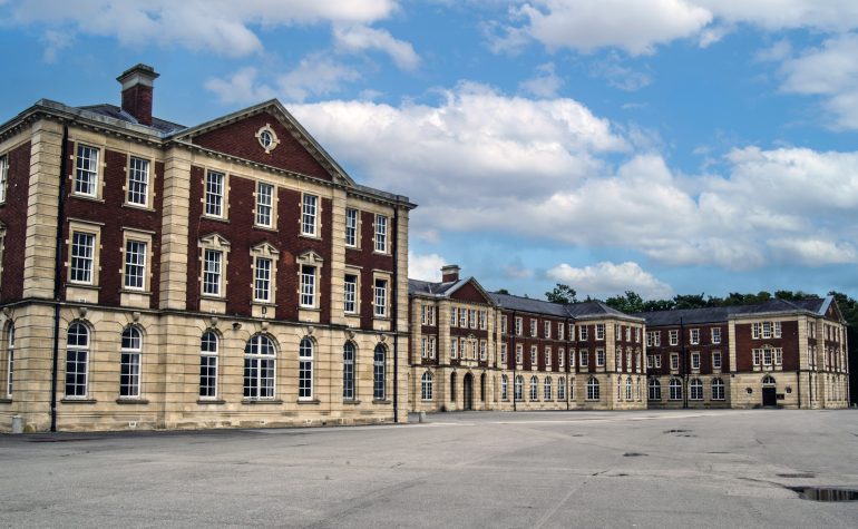 Wing of New College, Royal Military Academy, Sandhurst. A prestigious training centre for British Army officers. Sandhurst features distinctive and notable brickwork architecture that reflects its long-standing military tradition.