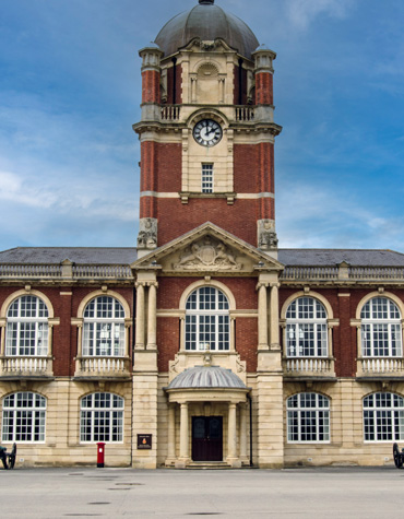 New College Clocktower, Royal Military Academy, Sandhurst. A prestigious training centre for British Army officers. Sandhurst features distinctive and notable brickwork architecture that reflects its long-standing military tradition.