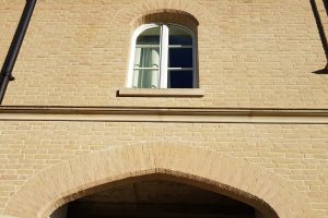 Structural brick window arches, created by Apex BrickCutters, at Peterhouse College, where the windows are set back from the brickwork.