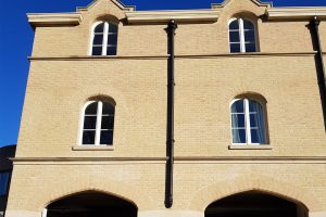 Structural brick window arches, created by Apex BrickCutters, at Peterhouse College, where the windows are set back from the brickwork.