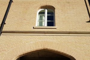 Structural brick window arches, created by Apex BrickCutters, at Peterhouse College, where the windows are set back from the brickwork.