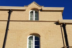 An example of structural brick window arches, created by Apex BrickCutters, at Peterhouse College.