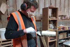 An Apex Brick Cutters employee works on creating brick slips from whole bricks, to be sold to either large or small home builders.