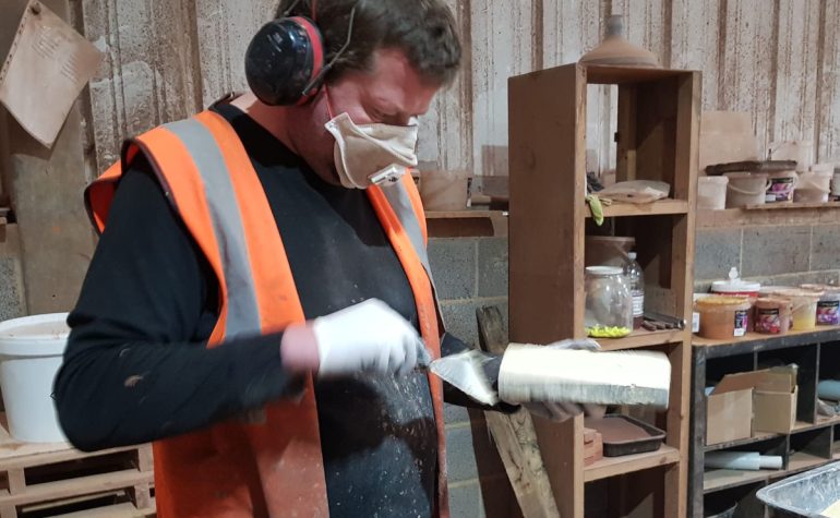 An Apex Brick Cutters employee works on creating brick slips from whole bricks, to be sold to either large or small home builders.