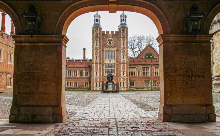 The facade view of the Eton College. The school’s brickwork design is a mix of medieval, Gothic, and modern architectural styles, creating a striking and atmospheric campus