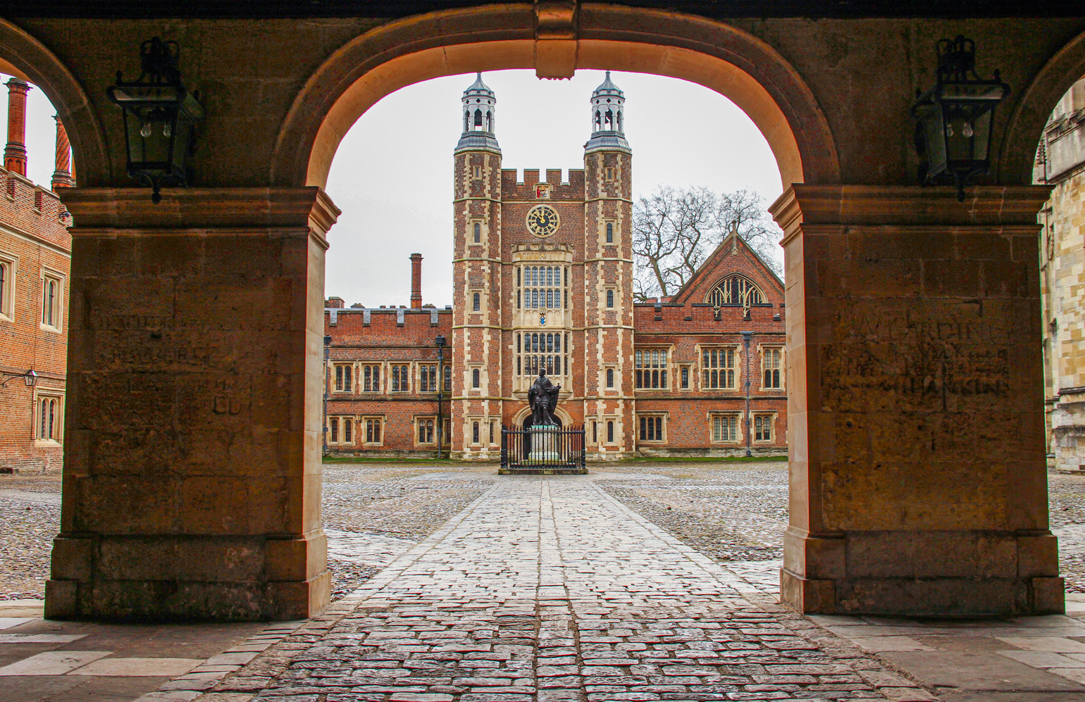The facade view of the Eton College. The school’s brickwork design is a mix of medieval, Gothic, and modern architectural styles, creating a striking and atmospheric campus