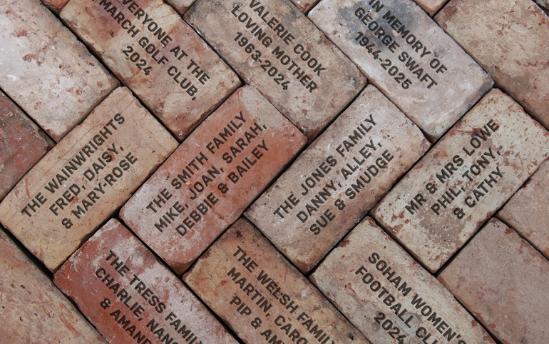 An example of bricks being engraved with custom text for a charity fundraising project
