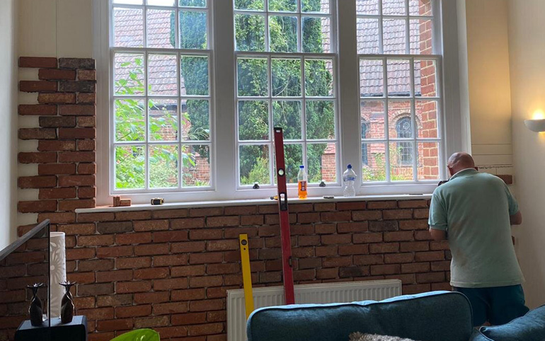 Apex Brick Slips are being fitted inside a client's home, by our Approved Installer - Brick Slip Facades UK Ltd.